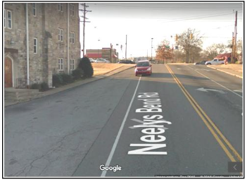 Google’s camera captures a car crossing over the line from Neely’s Bend Road (near Gallatin Pike) into an undefined paved area where people sometimes walk adjacent to City Road Chapel. Due to the lack of curb and gutter, ill-defined roads can cause hazardous conditions for drivers and pedestrians.